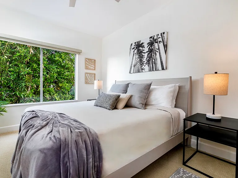 King bedroom with peaceful bamboo privacy, blackout shade and direct bathroom access.