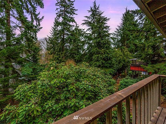 Two set of French doors open to a balconette overlooking the private back yard