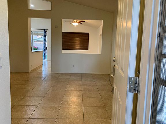 View from from entry door- Enter into drawing room-Can see the family room and exit to patio