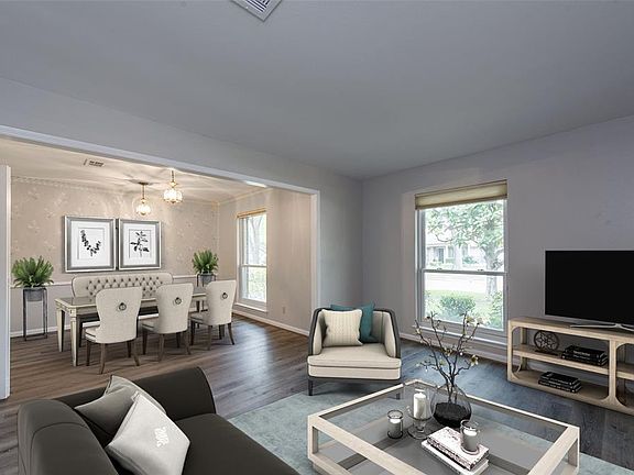Formal living and dining roms to front Virtually staged photo.