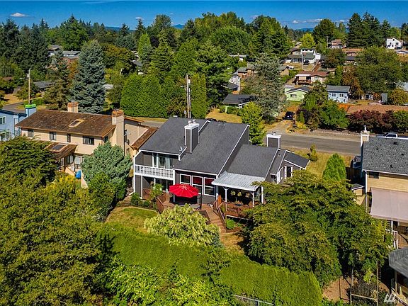 The backyard is enveloped by mature trees providing amazing privacy. Enjoy the huge deck and hot tub both done in (2016).