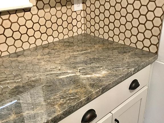 Top of the Line Quartzite Stone & Hex Backsplash