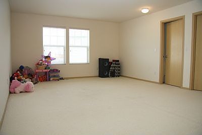 Spacious upper level bonus room adjoins all of the bedrooms.