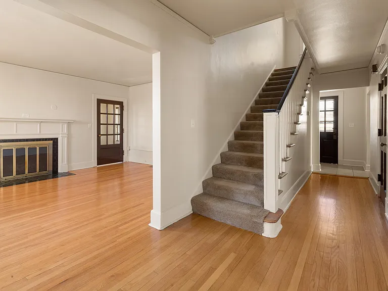 2 story home with wood floors.