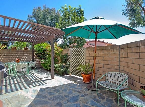 Large patio is partially covered for sun or shade. Privately situated.