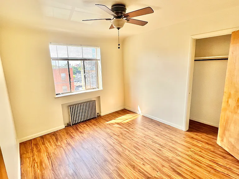 Bright and airy bedroom featuring elegant wooden floors and a serene view. Bright and airy bedroom featuring elegant wooden floors and a serene view.