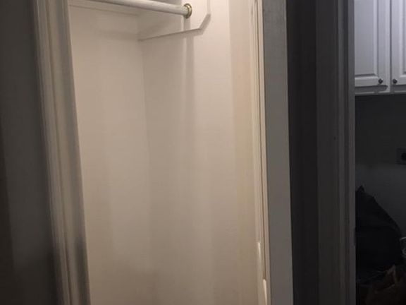 Coat closet walking in from laundry room