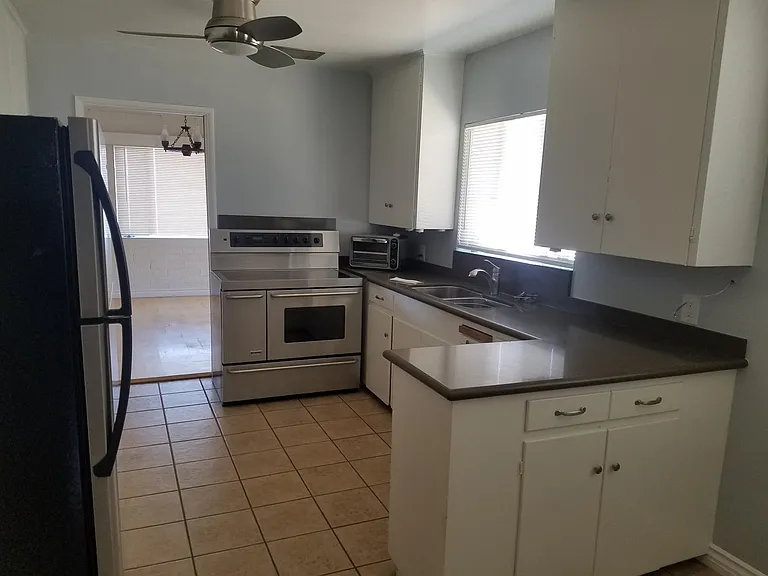 Kitchen leads into dinning room. It also has a door leading into family room.