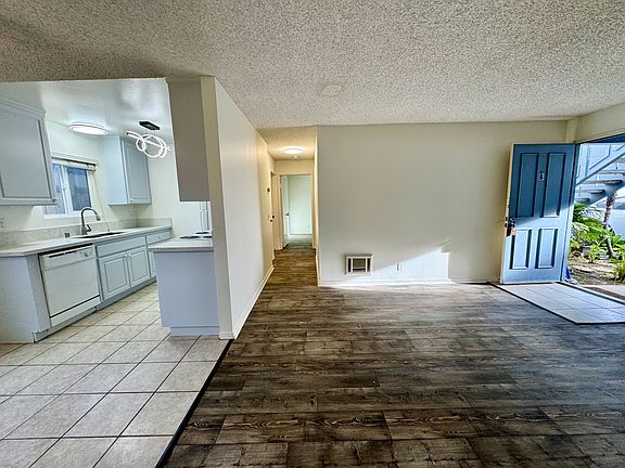 View from living room into kitchen and hallway