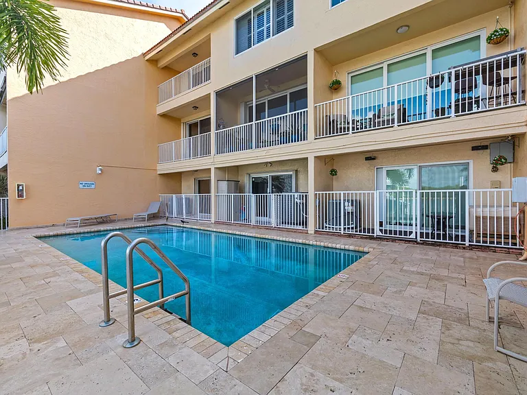 Two balconies over looking community pool - easy access & great for when you have guests.