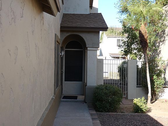 Front side yard walk to front door. Note gate access to back yard.