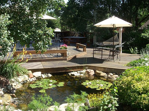 View from garden to deck and tub