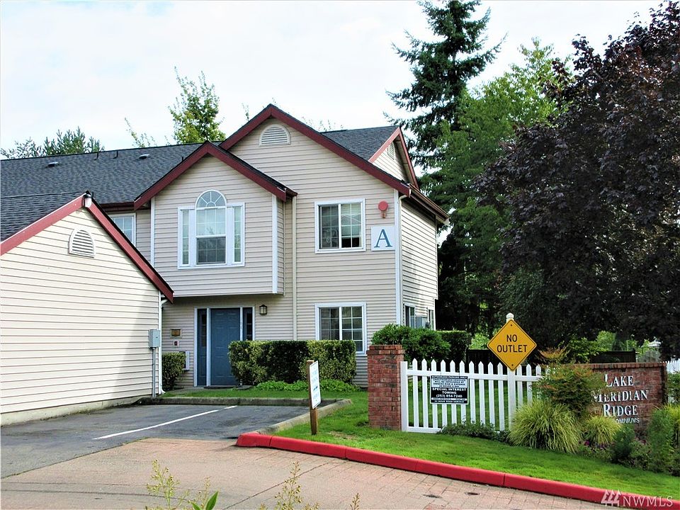 Front of the Unit from the Driveway. The assigned garage is on the left.