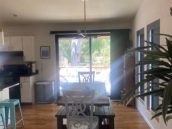 Dining table and oversize slider door out to deck