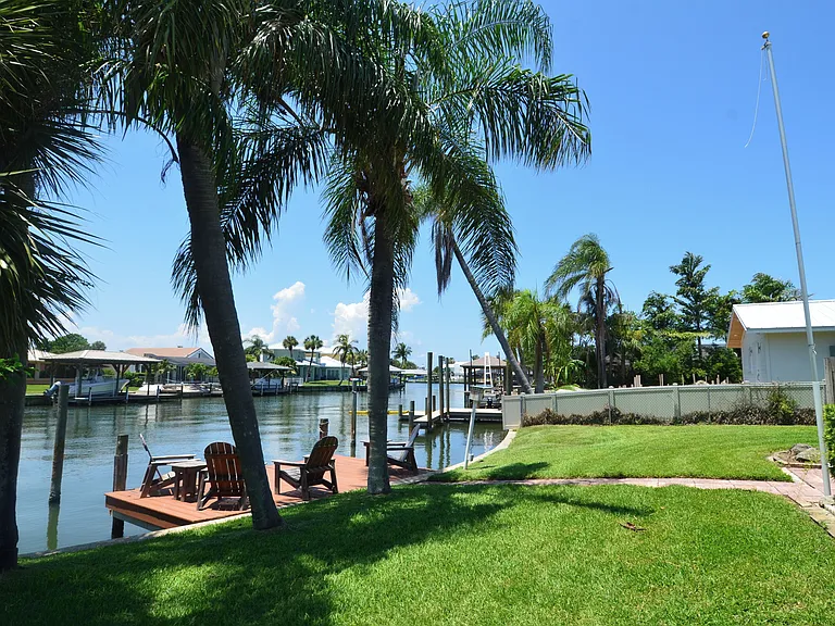 Backyard with dock viewing the Banana River inlet - lots of dolphin and manatee sightings daily