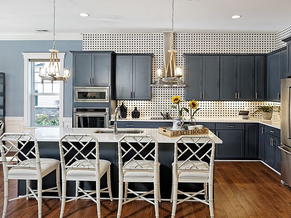 The kitchen of the Monet III at Lakeside at Trappe by Brookfield Residential