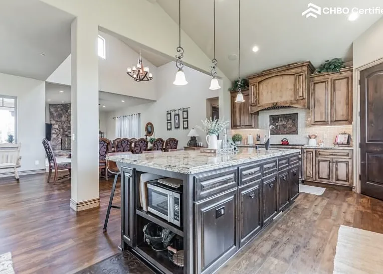 Island with microwave and cabinets for storage