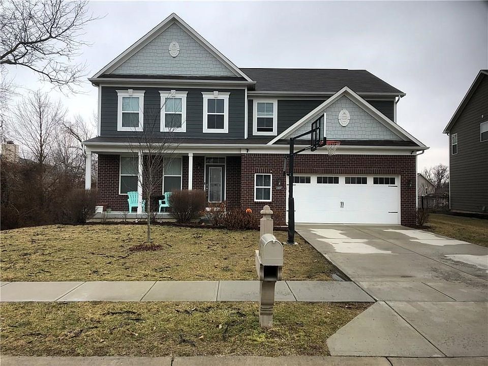 Gorgeous two-story in Smokey Row Estates with brick and cement siding exterior.