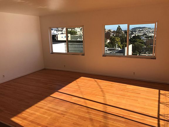 Living room. Southern views of Bayview, Candlestick Point,
