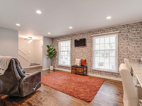 Large living room has been outfitted with two work