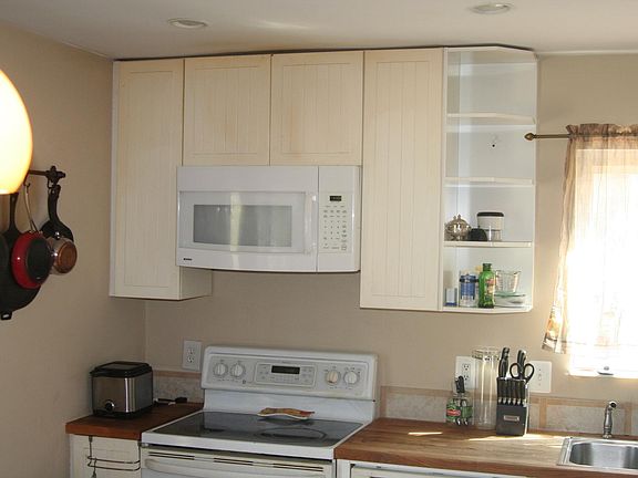 Wall cabinets and stove.