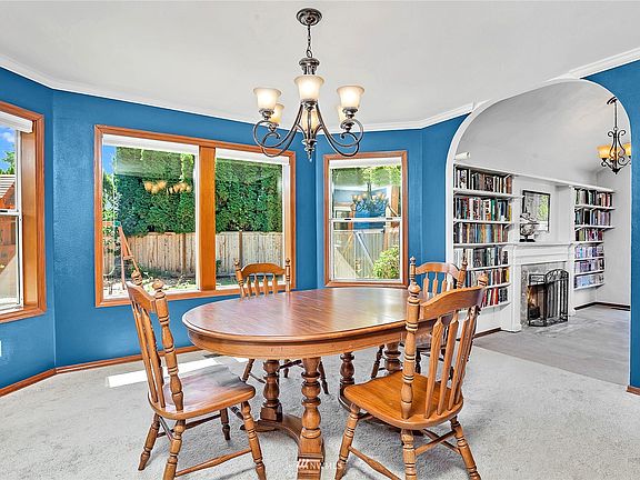 Formal living room has bright windows with motorized shades>