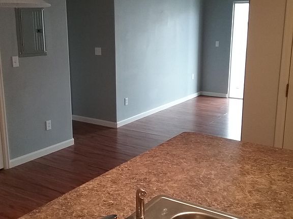 Lots of natural light - CARPET on dinning, living room and hallway (This picture shows an identical unit without carpet)