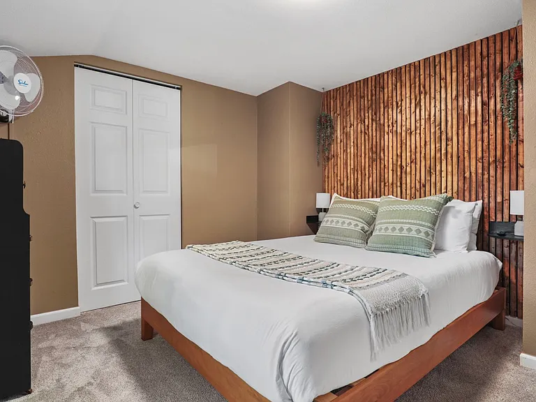Queen bed, closet, fan, 40" smart TV, dresser.