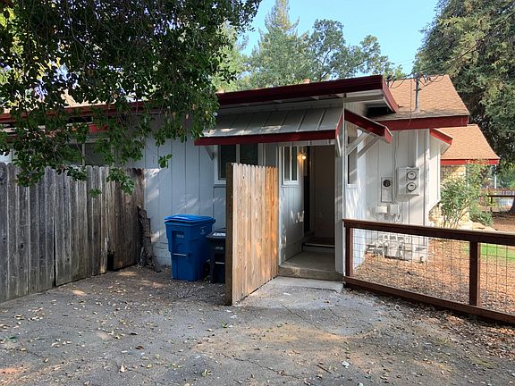 Kitchen entrance and garbage bin storage
