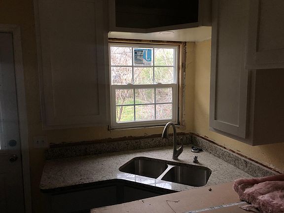Kitchen. New window and granite counter tops with new custom cabinets.