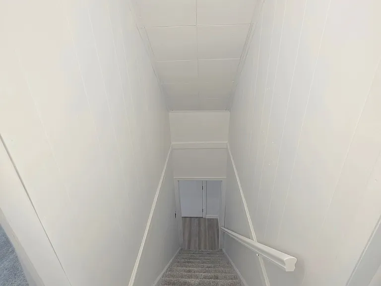 Stairs leading the upper bedrooms