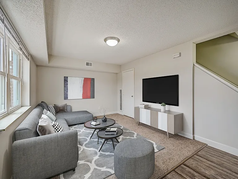 3 BR 1 BA Recently Renovated Townhouse Style Apartments featuring New gray carpet, Neutral paint scheme, Premium hardwood-style flooring, Neutral paint scheme, Upgraded light fixtures, New cabinets, Matching stainless steel appliances, Washer/Dryer, Air c