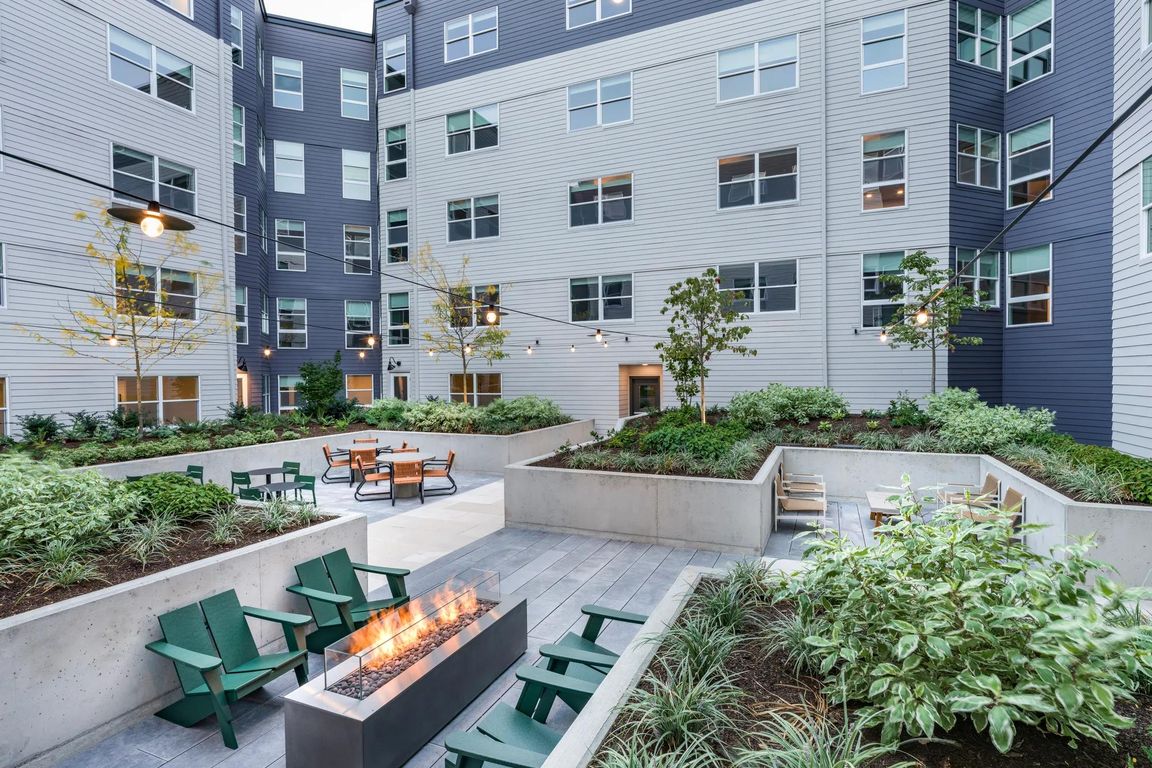 Relax in the meticulously landscaped courtyards offering lounge seating and a cozy fire table.