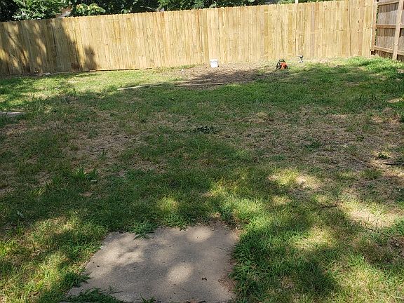 Fully fenced back yard with access to the cellar/basement.