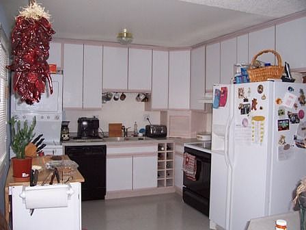 Remodeled kitchen with all the appliances including the washer and dryer.