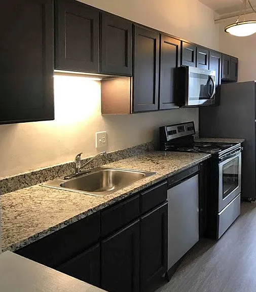 Upgraded townhome with granite countertops, stainless steel appliances and plank flooring