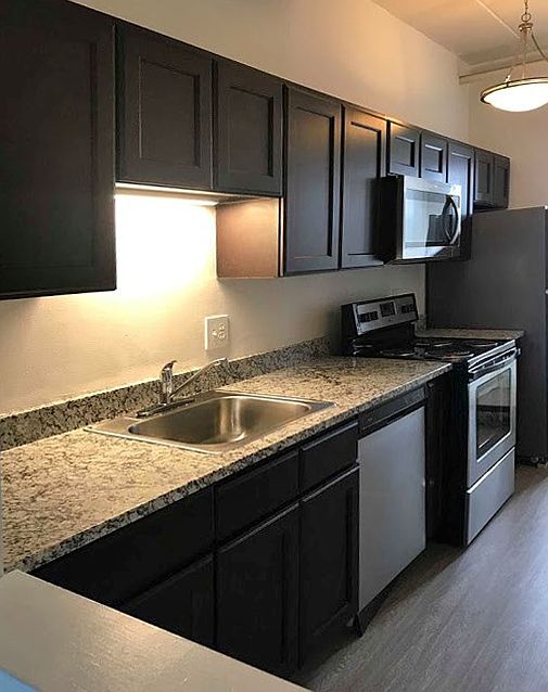 Upgraded townhome with granite countertops, stainless steel appliances and plank flooring