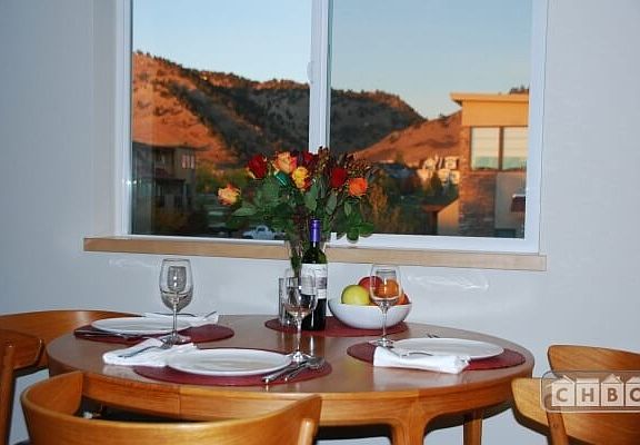 Dining room table and view west. Expands to f