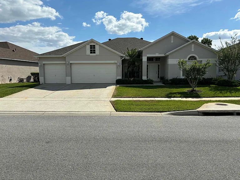 Front view of house showcasing beautiful curb appeal with 3-car garage
