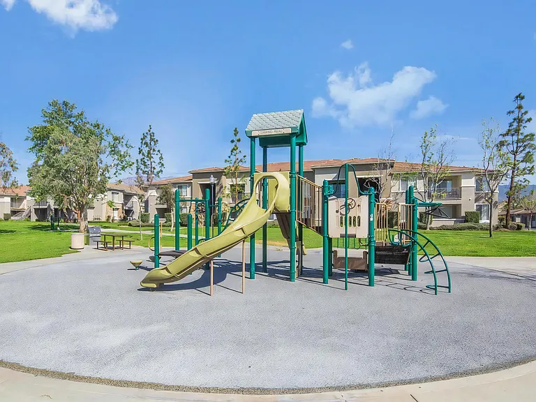Kid-Friendly Playground with Swings, Slides, and Open Space
