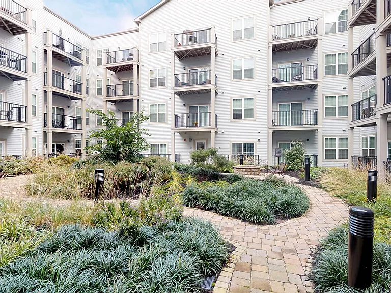 Lush courtyard, cozy fire pit and social seating