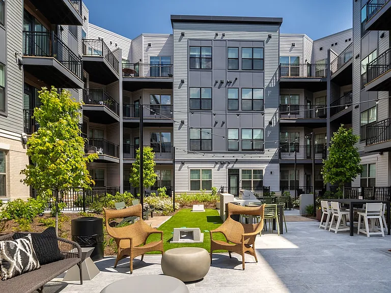 2 Campus courtyard with lounge seating and cornhole