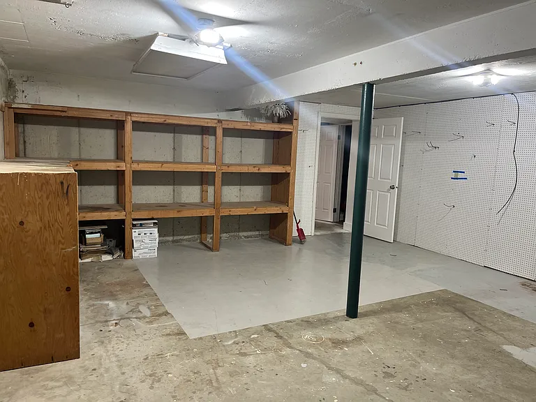 Downstairs storage room under garage
