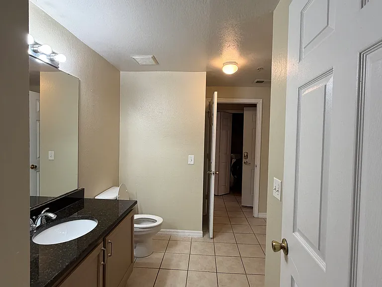 Bedroom 1 has direct access to the bathroom through a single door.