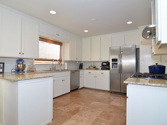 Kitchen with travertine flooring