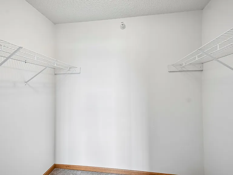 Maximize your storage potential with this spacious closet at Mill Pond Apartments. Thoughtfully designed with ample shelving to keep your belongings organized and accessible. Don't miss out on making this apartment your new home. Inquire today!