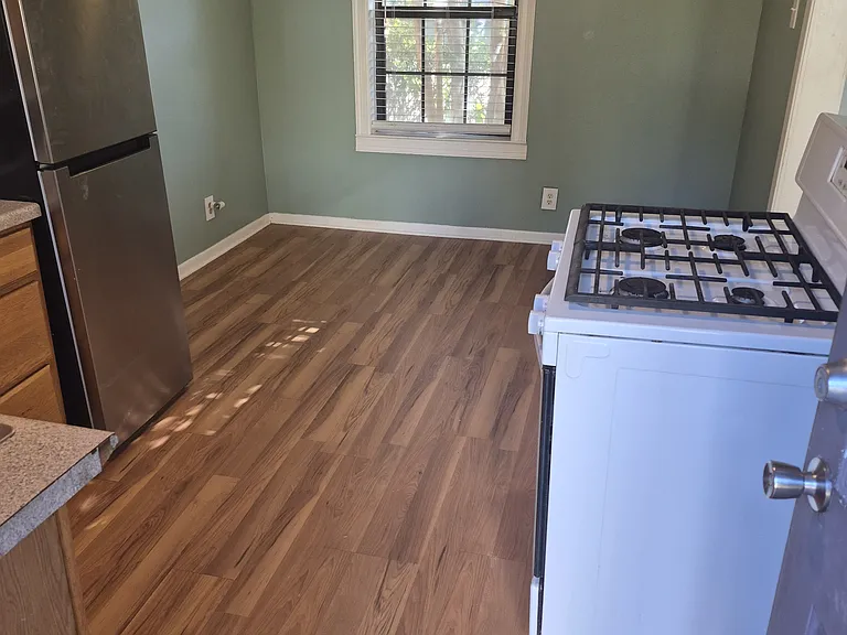From back door, through kitchen into dining area