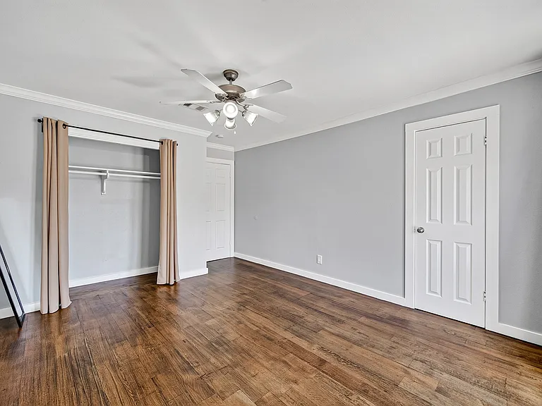 2nd bedroom with plenty storage space. The door on the right is the closet.