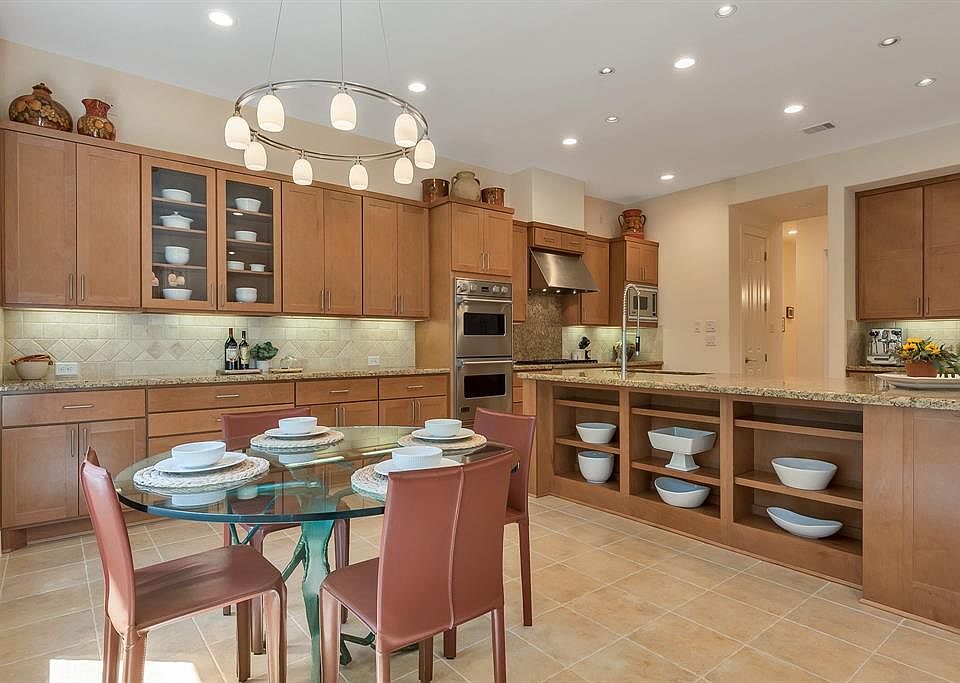 90 S Player Manor's stunning, sleek, modern, gourmet kitchen with Viking appliances is both functional and fabulous for everyday meals and entertaining. Granite countertops, abundant soft closing cabinetry, large 10x8 L-shaped island with storage and