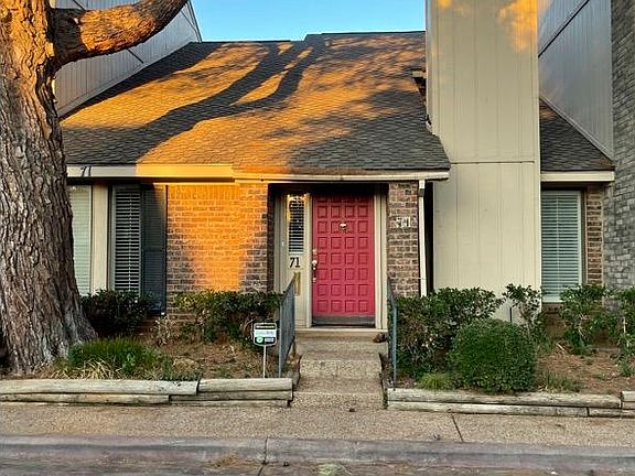 Front parking area but also garage in back for two cars.